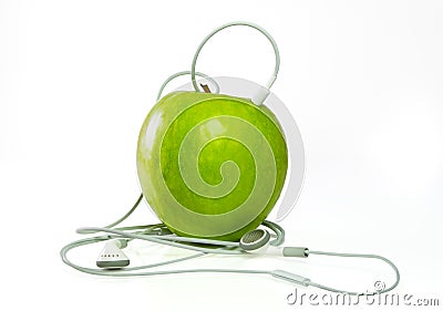 Apple Earphones on Home   Royalty Free Stock Photography  A Green Apple With Headphones
