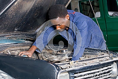 African Mechanic Repairing A Car Royalty Free Stock Photo - Image ...