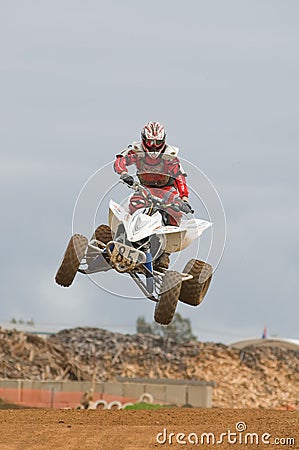 Atv Motocross Rider Over A Jump