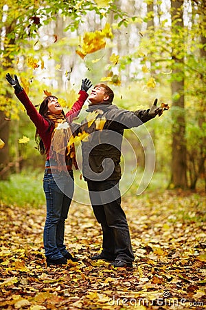 Autumn - Happy Couple Enjoying Falling Leaves
