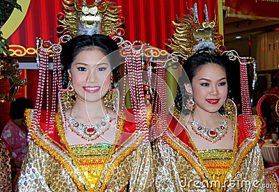 Chinese Dress on Two Beautiful Women Dressed In Opulent Chinese Clothing Are Part Of