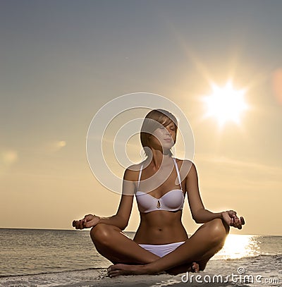 beautiful-girl-yoga-on-the-beach-at-sunset-thumb15660988