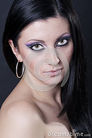 blue and purple makeup. Royalty Free Stock Photography: Brunette woman with lue and purple makeup