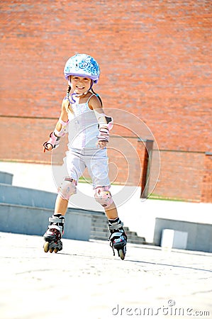 Child On Inline Rollerblade Skates Stock Photo
