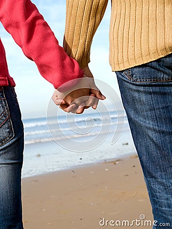 couple holding hands in sunset. love holding hands quotes.