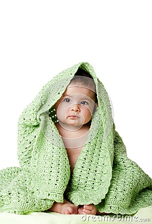 Cute baby sitting between green blanket. Stock Image - Image: 14325881