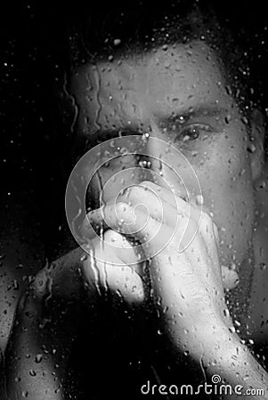 Depressed Man Looking Through The Window At Night Royalty Free Stock Images - Image: 10390579