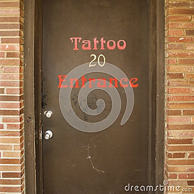 Doorway entrance to tattoo parlor. Keywords: