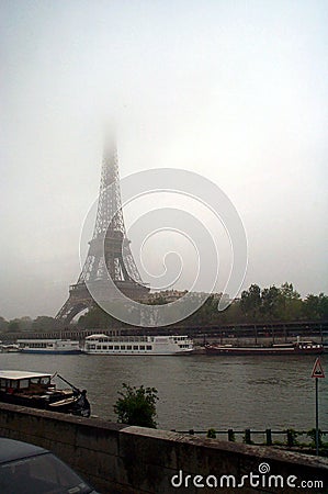 Rainy Eiffel Tower Pictures on Eiffel Tower Against Cloudy Skies
