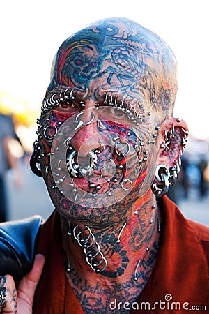Editorial Image: Face with tattoos and piercings