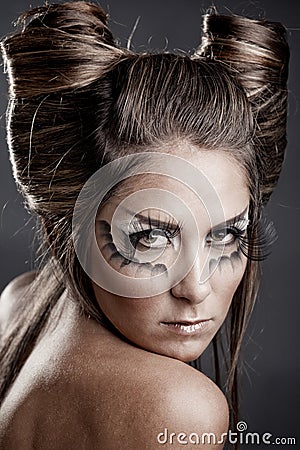 Makeup Studio on Model With Halloween Makeup And Hairstyle On Gray Studio Background