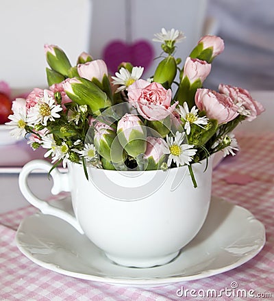 Flowers In A Cup On A Pink