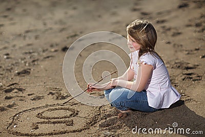 Girls Number on Home   Stock Photo  Girl Writing Number In The Sand
