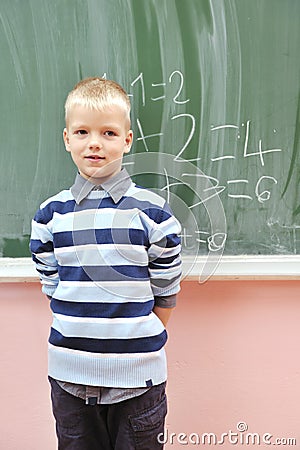 HAPPY YOUNG BOY AT FIRST GRADE MATH CLASSES © .shock | Dreamstime.com