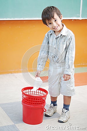 little-cute-boy-throwing-paper-in-recycle-bin-thumb10631151.jpg