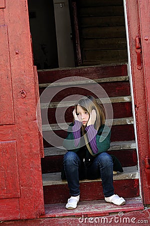Royalty Free Stock Image: Lonely little girl standing on stairs