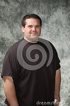posing men for portraits. Overweight young man posing in