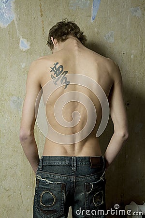 male back tattoos. MAN WITH TATTOO ON THE BACK