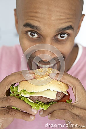 fat person eating burger. Images EEN - Aged