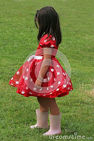   White Polka  Dress on Little Girl In A Red And White Polka Dot Dress Wearing Pink Wellington