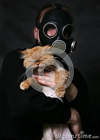 RED CAT The man in a gas mask holds 