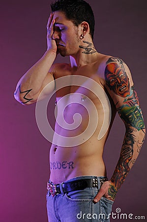 Stock Photo: Sad male with tattoos