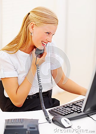 Secretary Using A Telephone In Office Royalty Free Stock Photography - Image: 10745197