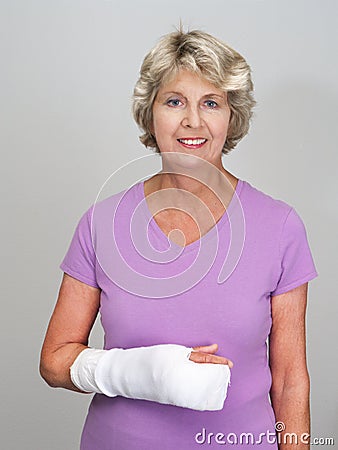  Architecture on Elderly Woman Smiling And Looking At Camera  Holding Her Bandaged Arm