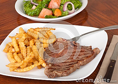 http://www.dreamstime.com/t-bone-steak-dinner-thumb15264094.jpg