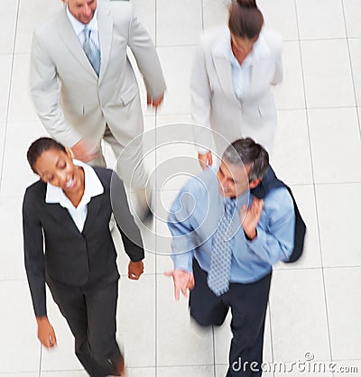TOP VIEW OF A BUSINESS PEOPLE WALKING AWAY (click image to zoom)