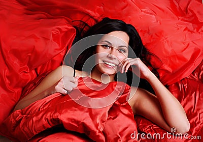 Woman On Red Silk Sheets
