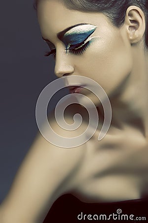 turquoise eye makeup. WOMAN WITH TURQUOISE EYE