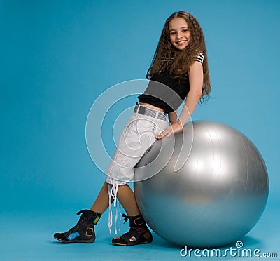 Sweet Girls on Royalty Free Stock Photography  Young Sweet Girl With A Big Grey Ball