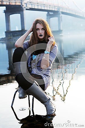 Stock Photo: Young woman siting on the chair. Image: 17113180
